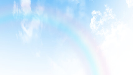 Wall Mural - A view from below of large white clouds in the blue sky. Rainbow effect blue sky background