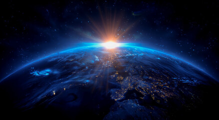 Wall Mural - A blue, glowing earth with the sun rising on it, against a dark background.