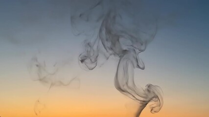 Wall Mural - Abstract wisps of ethereal smoke slowly drift and swirl against a fading evening sky at dusk fantasy, moody, fog