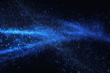 Wall Mural - Stunning blue light particles scatter across a dark background creating a cosmic atmosphere