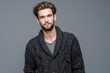 © LimeSky - Fashionable young man wearing a knit cardigan against a gray backdrop