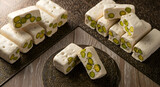 Delicious Pistachio Nougat Displayed Elegantly on Ornate Metallic Surfaces