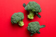 © sosiukin - green fresh broccoli background close up on colored table. Vegetables for diet and healthy eating. Organic food