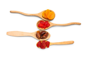 Wall Mural - Wooden spoons with different candied fruits on white background