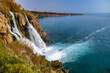 © Vlad Rakin - The powerful Lower Duden Waterfalls cascade from rocky cliffs into the Mediterranean Sea, creating turquoise foam patterns visible from the viewpoint overlooking Lara's resort coast. Antalya, Turkey.