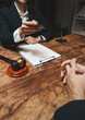 © crizzystudio - Lawyer offering pen for client contract signing