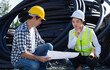 © crizzystudio - Construction workers reviewing blueprint at job site