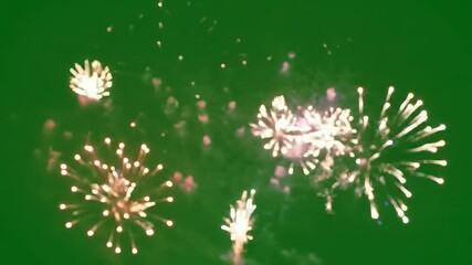 Vibrant fireworks display exploding in the dark night sky, festive celebration background for holidays, New Year's Eve, and Thanksgiving events.