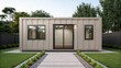 © supaporn - Accessory Dwelling Unit Modern minimalist house with large windows, surrounded by greenery and a tidy pathway leading to the entrance.