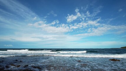 Wall Mural - Time lapse of shifting white clouds over calm Adriatic waters along Croatia’s coast.