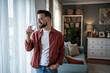 © Migma_Agency - Man drinking fresh water at home for healthy lifestyle