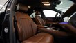 © millennium - Modern luxury car interior with brown leather seats and ambient lighting showcasing comfort and elegance