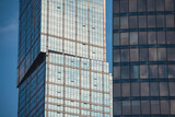 mirrored windows of the facade of an office building