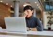 © Lumos sp - Portrait of a middle aged young businesswoman sitting at table with laptop computer in the office,  with headache, sick, tired or fatigue while working late . Burnout, stress and deadline concept
