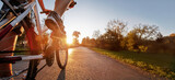 riding bicycle outdoors, closeup of foot on pedal low angle, cycling background banner