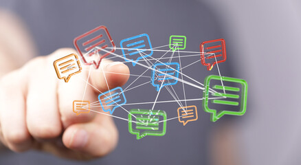 A hand pointing at a network of connected message bubbles representing digital communication, technology and global connection.