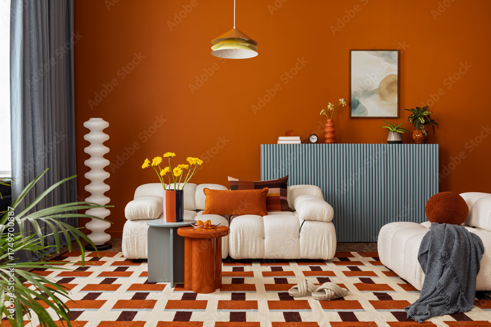 Modern living room with orange wall, soft sofa and blue sideboard ...