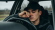 © Bayu Tri Nugroho - Drowsy Driver Risks Fatal Crash Exhausted Fatigue Young Adult Behind Wheel Eyes Closed Nodding Off Asleep Automobile Vehicle Risk Safety Alertness Awareness Accident Prevention