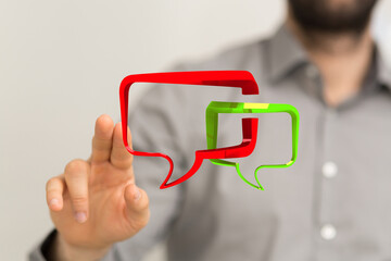 A man interacting with digital speech bubbles represents connection, communication and interaction within business online social platform.