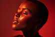 © Marut - Portrait of woman with short hair, glowing skin, closed eyes, and serene expression under dramatic red light, highlighting smooth complexion and elegant features
