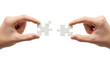 © Md - Hands holding puzzle pieces to connect on black background teamwork