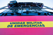 © AlbertoRodriguez - A red and yellow sign on a truck that says 'Unidad Militar de Emergencias' in Spanish