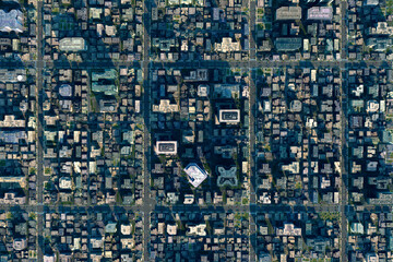 Top-down 3D view of geometric city blocks with strong symmetry and light