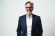 © Pete - Mature bearded man in glasses and suit smiles confidently. Executive looks forward, showing experience. Pro poses on white background, represents success and leadership. He is a businessman.