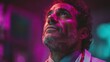 © irina - Man in medical coat gazes upward with focused expression in a dimly lit room filled with colorful lights in a medical setting