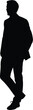 © Nasira Mai - Silhouette of a man in a suit walking with his hand in his pocket isolated on white background