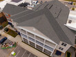 © Oak City Drone - Daytime Drone Images of a Mixed Use Development Featuring Ashpalt Shingles, TPO, and Standing Seam Metal Accents