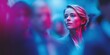 © keks20034 - Confident woman in glasses standing still among blurred crowd in neon light