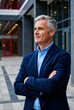 © K silver - Confident businessman posing in urban setting modern architecture professional portrait outdoor inspiring concept