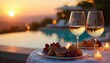 © Oleksandr - Table set for romantic dinner by the pool at sunset. Wine glasses filled with white wine, plates with dessert and red grapes, candles lit on white tablecloth. Pool and lounge chairs in the background.