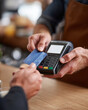 © lashkhidzetim - A man is paying for something with a credit card