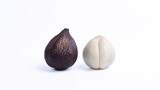 Whole and peeled salak or snake fruit isolated on white background. Exotic Indonesian tropical fruit for healthy diet, organic food, or Asian cuisine concept.