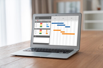 Wall Mural - Project planning software for modish business project management on the computer screen showing timeline chart of the team project