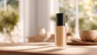 © Muh - Beige foundation bottle on a light wooden table, sunlit room