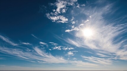 Wall Mural - Expansive Blue Sky with Wispy Clouds and Bright Sunlight Over Calm Ocean Horizon on a Clear Day, Perfect for Nature and Travel Themes