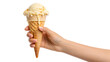 © MH24 - Hand holding a vanilla ice cream cone with melting ice cream against a plain black studio background on transparent background