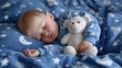 © Keo - A young child sleeping with a teddy bear on a blue blanket with white stars and moon patterns.