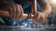 © dK - Close-up of hands repairing leaking copper pipe under sink with water splashing