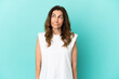 © luismolinero - Middle aged caucasian woman isolated on blue background having doubts while looking up