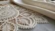 © Store - Delicate white lace pattern artfully draped with linen fabric