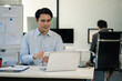 © NINENII - Happy man, entrepreneur, small business owner working online.
