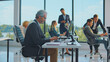 © Videophilia - Diverse business people actively working and collaborating on computers in a bright, modern office space, fostering teamwork and professional productivity during daytime