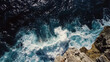 © soqib - Aerial view of ocean waves crashing against a rocky cliff, contrasting textures and colors