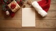 © Johannes - high angle view of empty letter on wooden table with christmas decoration top view of empty xmas wish list with little gift present and santa claus hat on wooden background no logos no brands ar 169