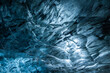 © Erika Valkovicova - Stunning frozen blue glacier cave showing vibrant blue ice details and abstract patterns and bubbles