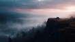 © Bussakon - A solitary tent rests on a cliff s edge overlooking a vast misty mountain valley during a serene sunrise